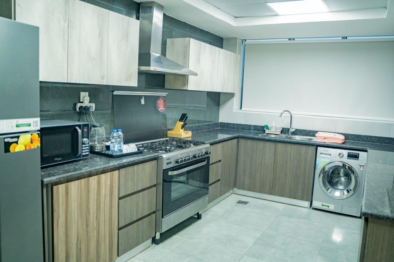 Luxe Grand Hotel Apartments Sharjah Esterno foto A modern kitchen