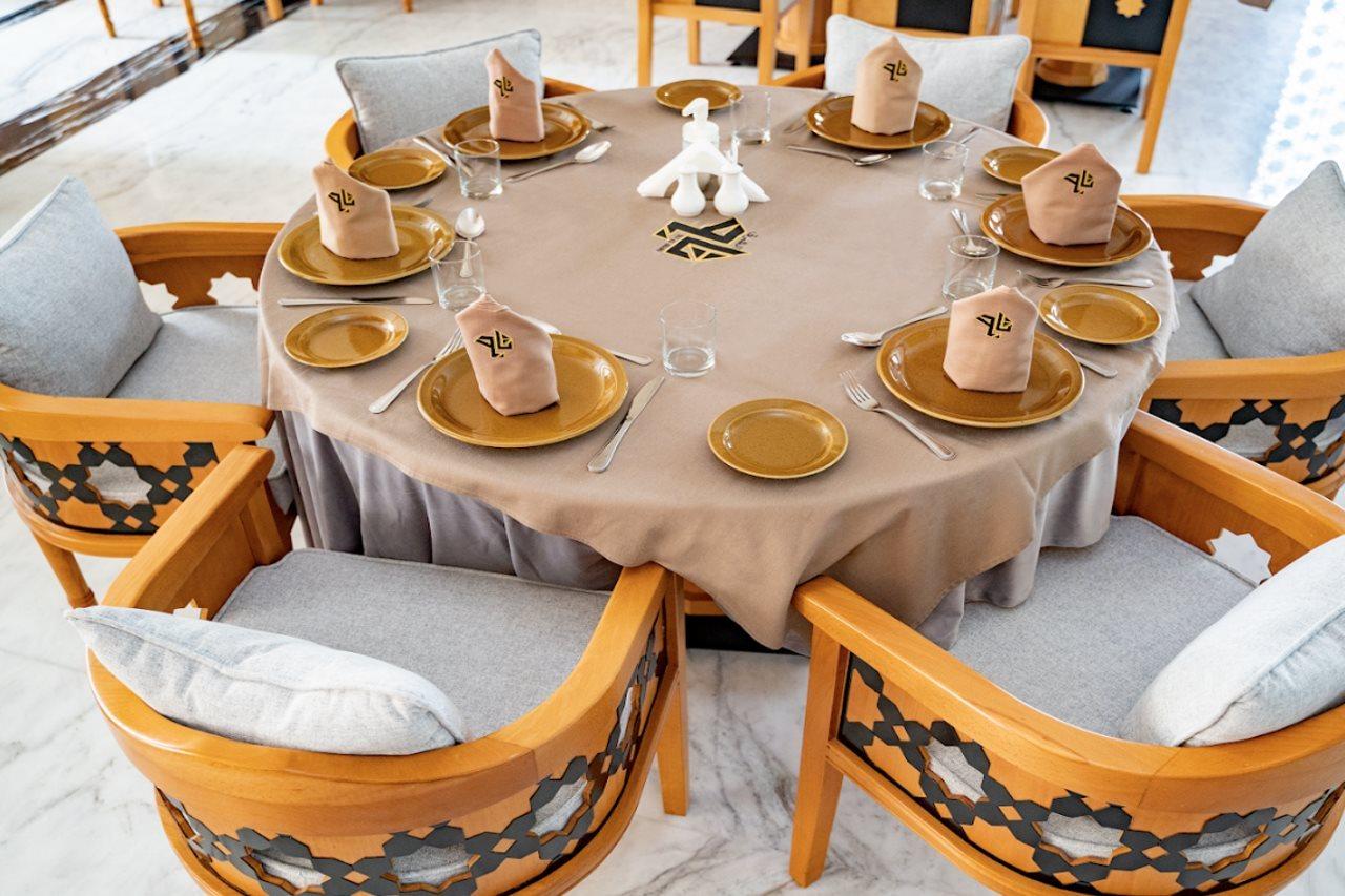 Luxe Grand Hotel Apartments Sharjah Esterno foto A table set for a Seder