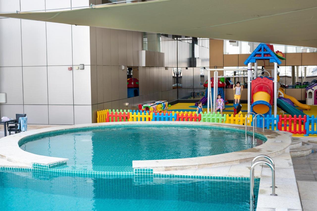 Luxe Grand Hotel Apartments Sharjah Esterno foto Swimming pool