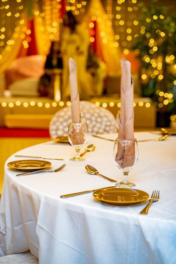 Luxe Grand Hotel Apartments Sharjah Esterno foto A table set for a meal