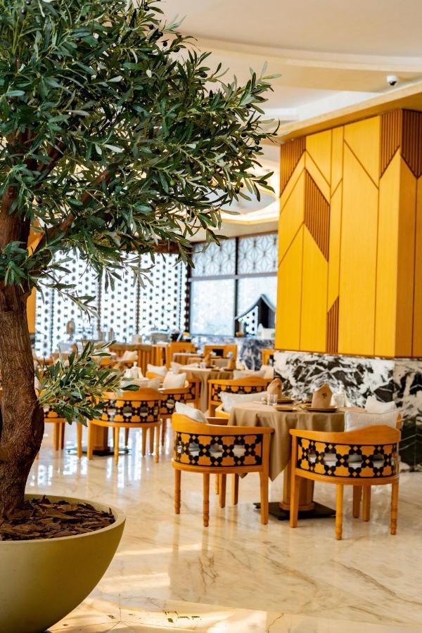 Luxe Grand Hotel Apartments Sharjah Esterno foto The restaurant