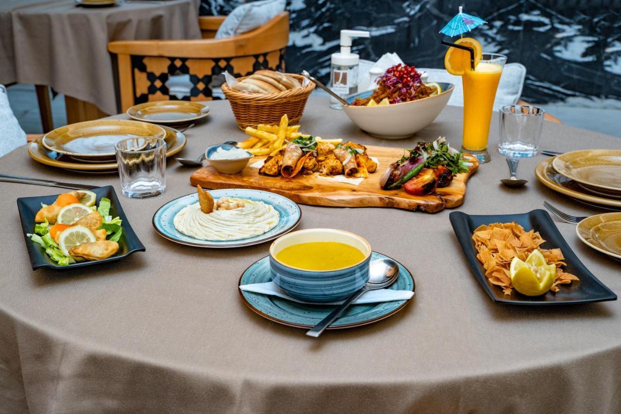 Luxe Grand Hotel Apartments Sharjah Esterno foto A selection of Turkish cuisine