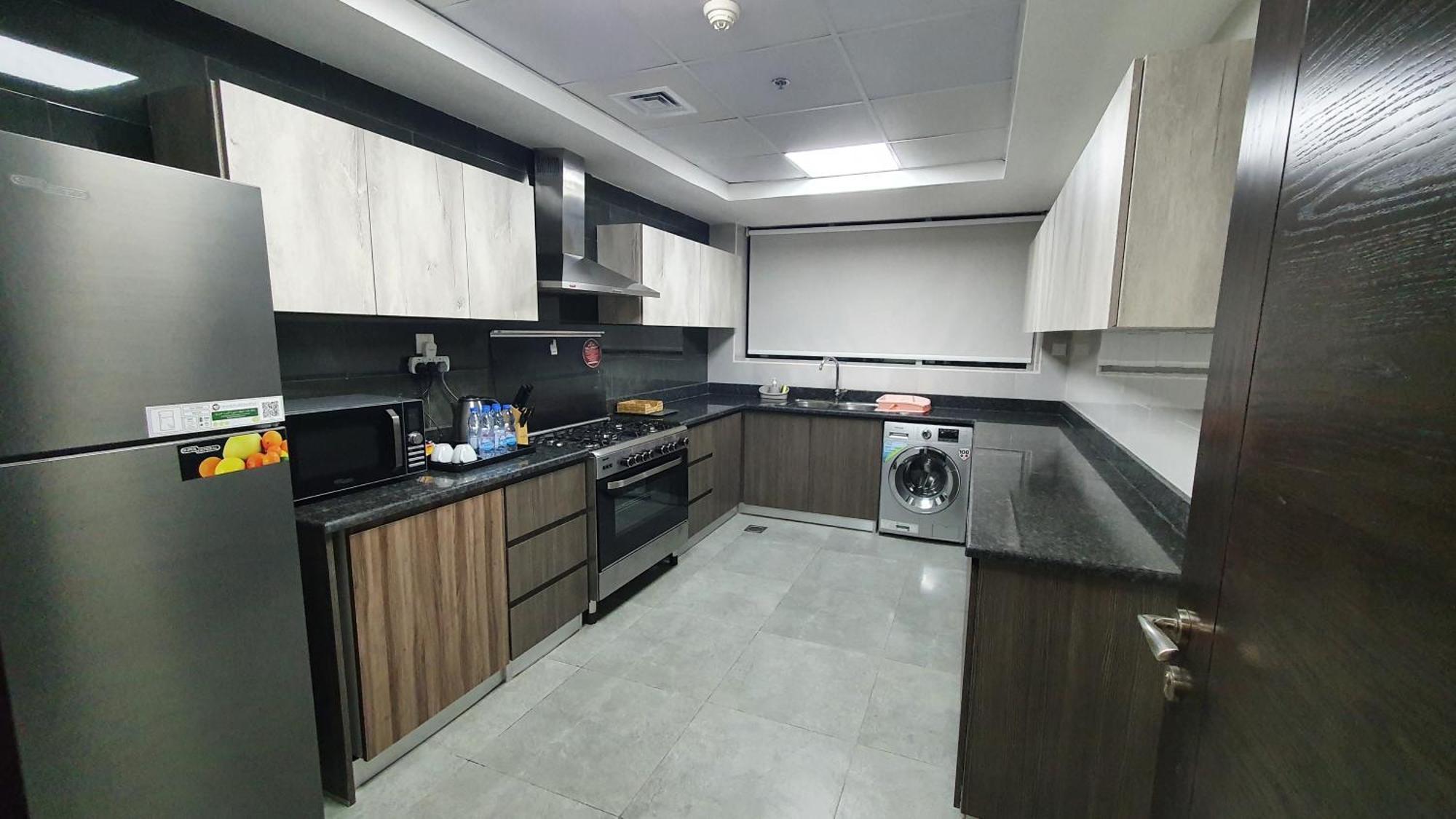 Luxe Grand Hotel Apartments Sharjah Esterno foto A modern kitchen in Dubai